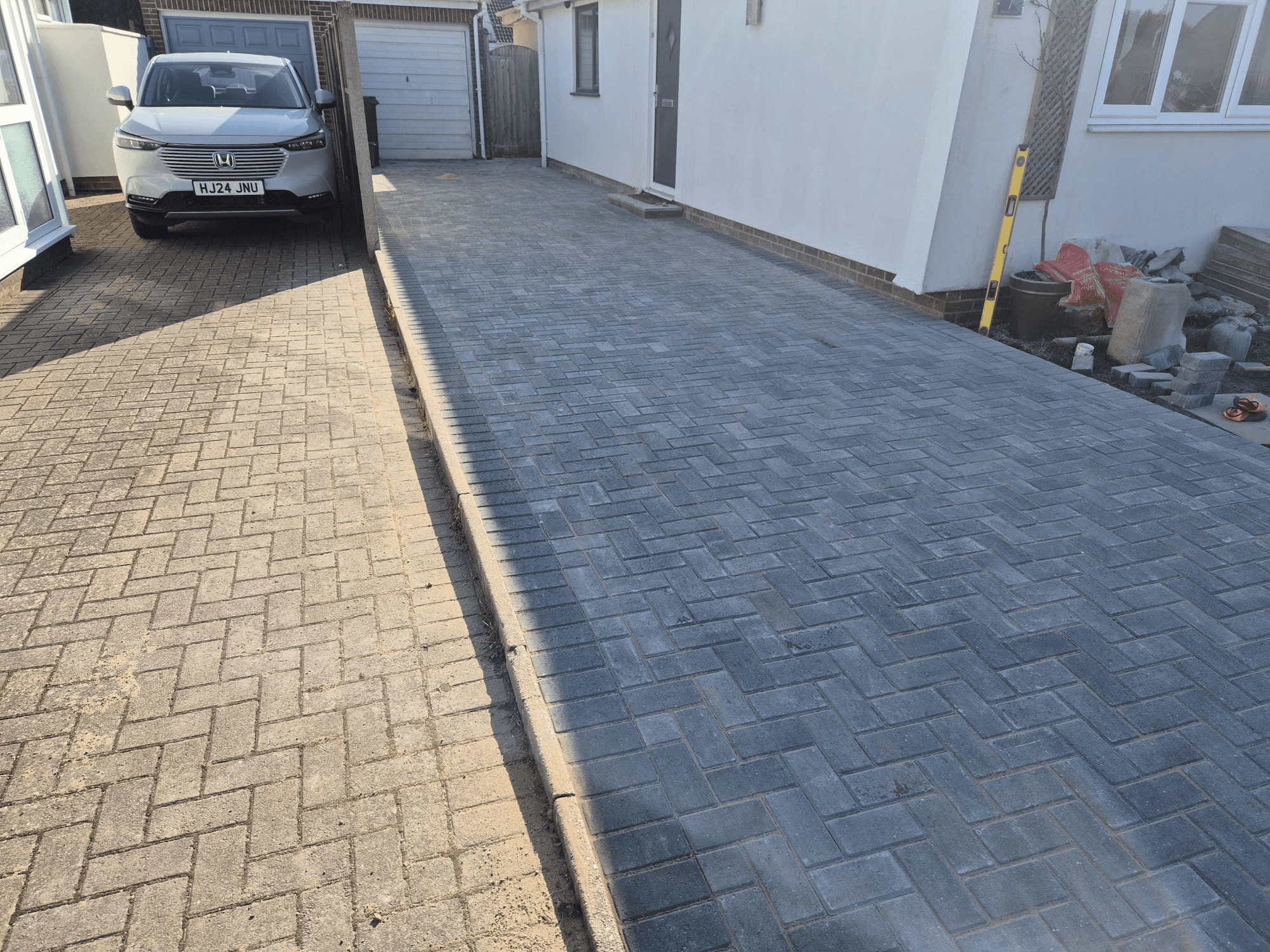 Completed block paved driveway — wide access with contrasting border edging