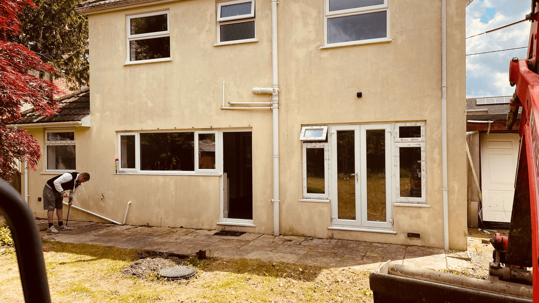 Rear of property during extension project — new windows and drainage works