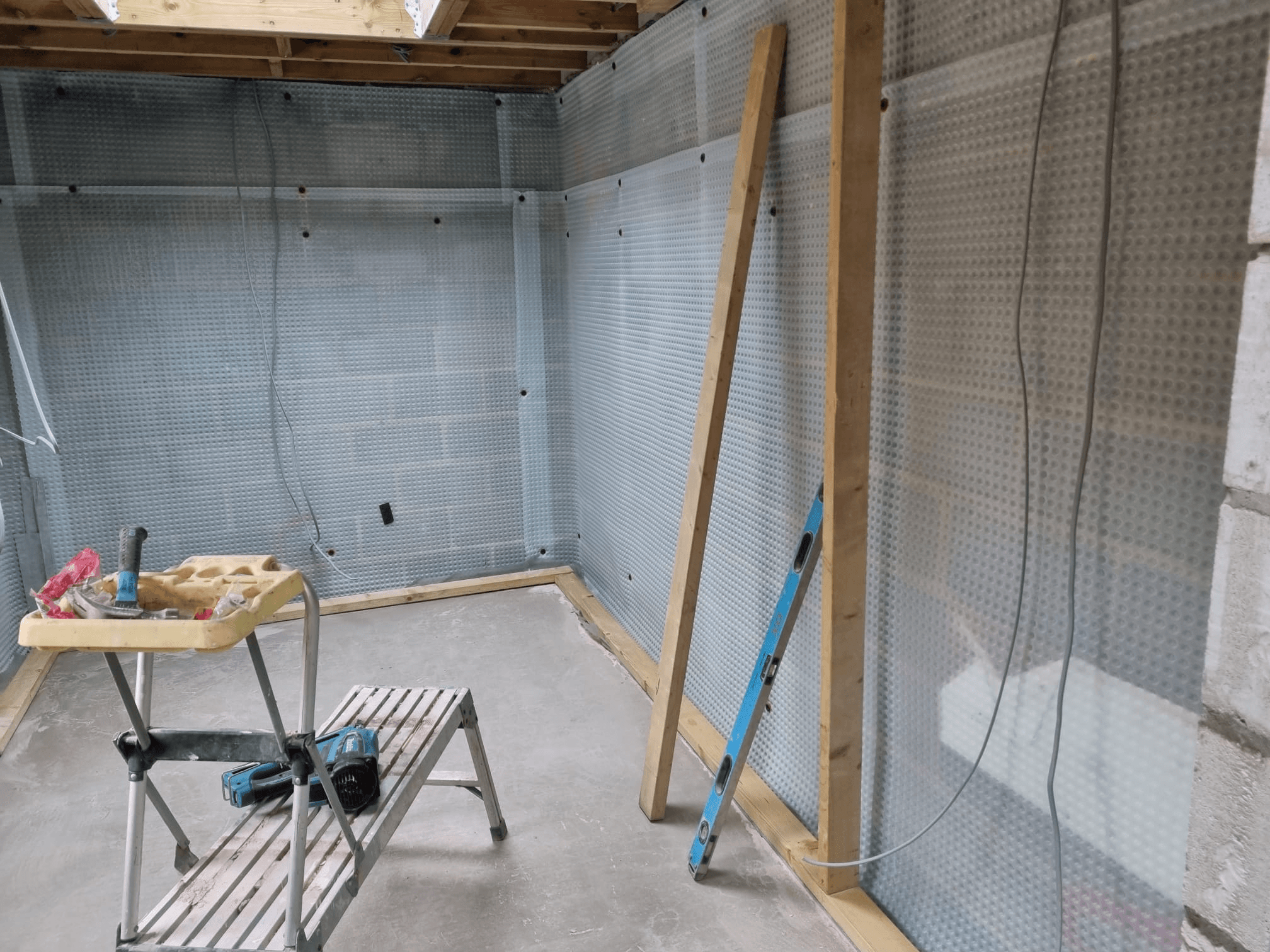 Extension under construction — render mesh applied to walls ready for plastering