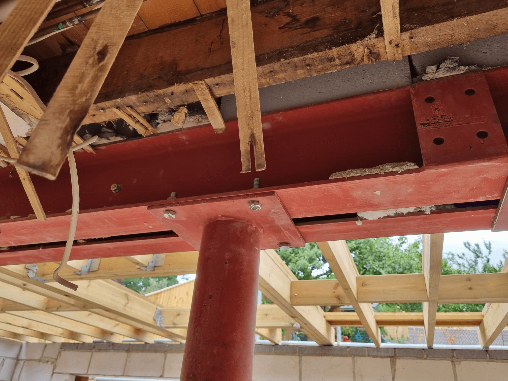 RSJ steel beam installed at roof level — structural support for extension and roof timbers