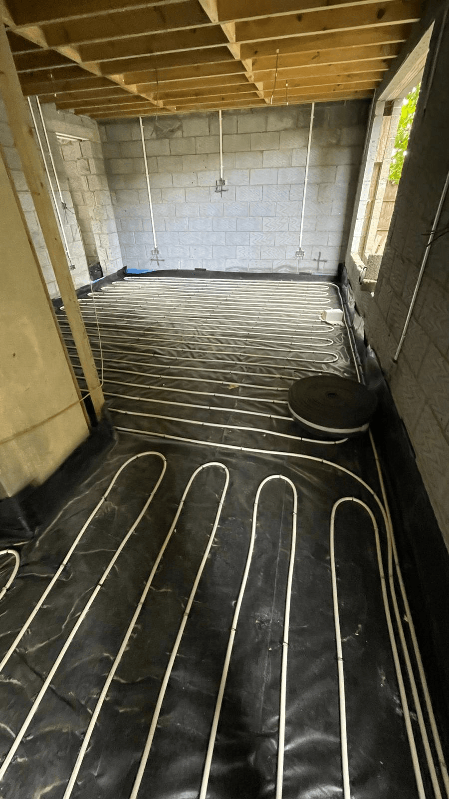 Underfloor heating pipes laid in new extension build